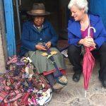 Old lady in Cusco teaches Tema how to weave