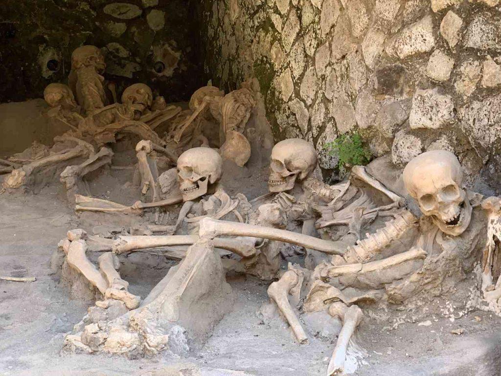 skeletons of people who were trying to escape the volcanic eruption, at the docks in Herculaneum, Italy