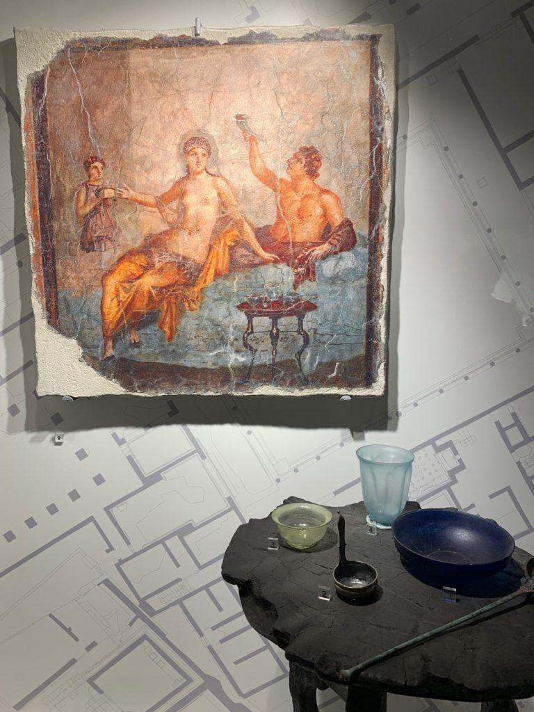 Art and tableware inside a Pompeii villa, Italy