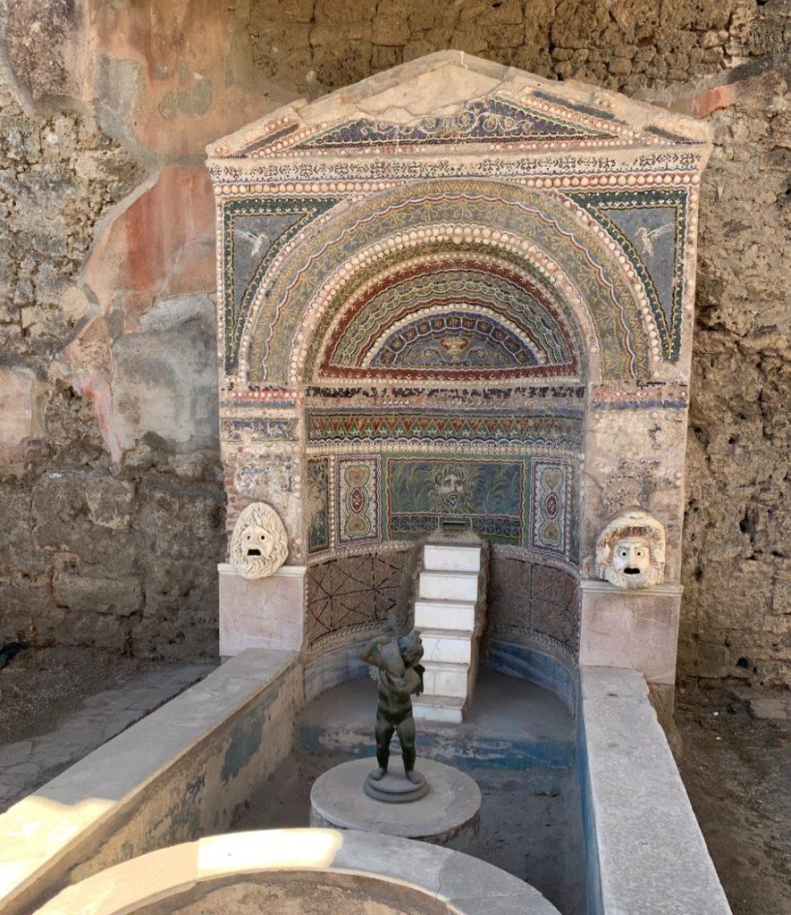 Beautiful villa archway and fountain in Pompeii, Italy