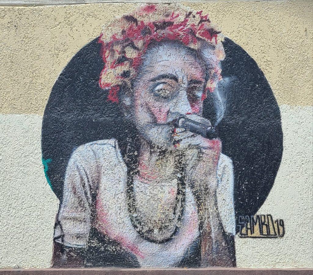 Old woman smoking a cigar, street art Cuenca Ecuador