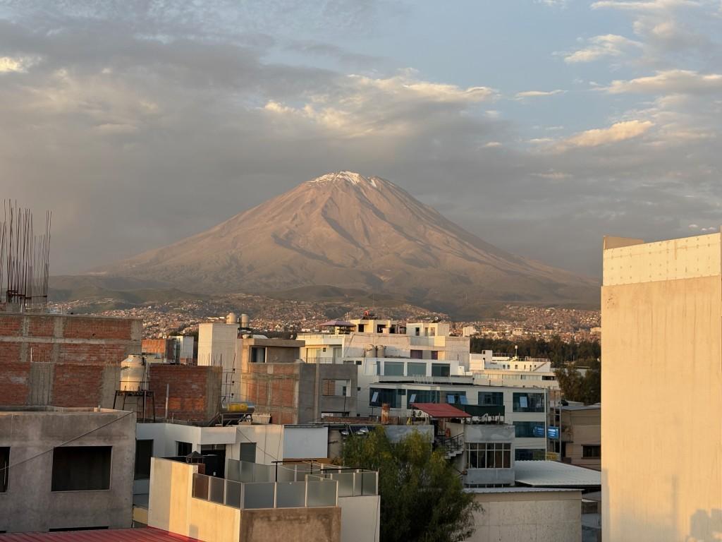 Arequipa, Peru: Misti volcano seen from our apartment; Plaza de Armas at night
