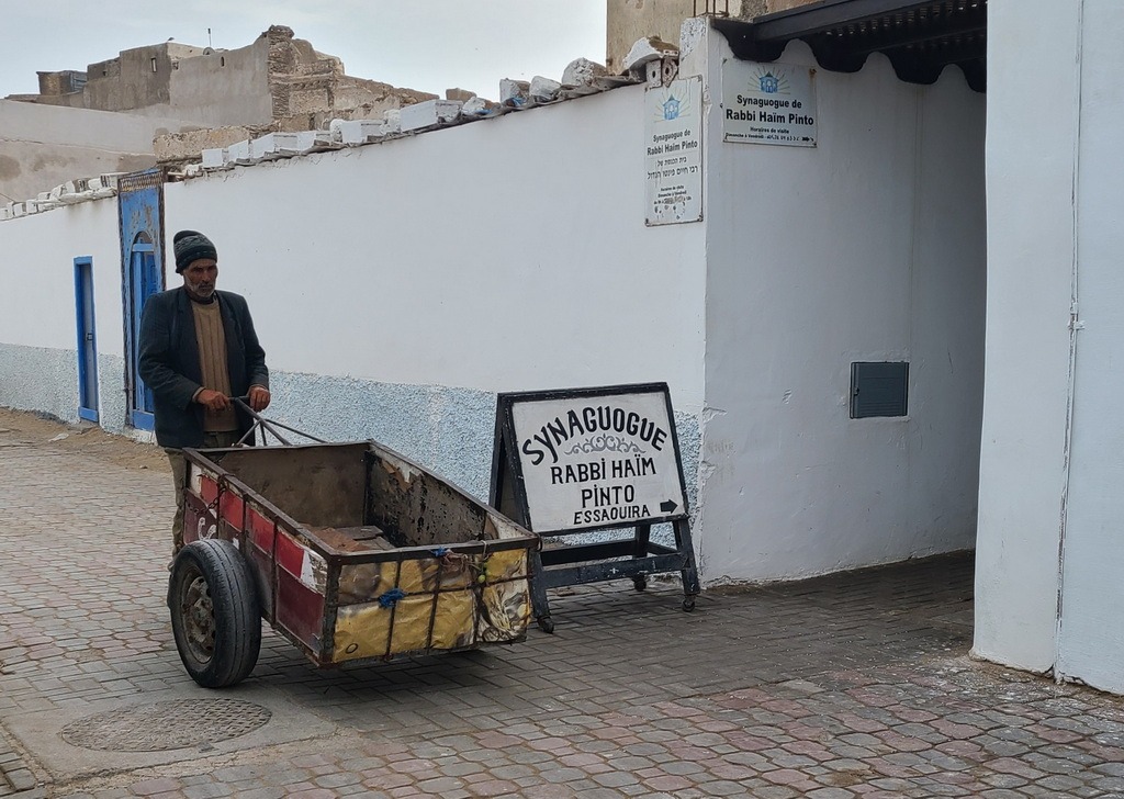 Porter in front of Pinto Synagogue in Essaouira, Morocco