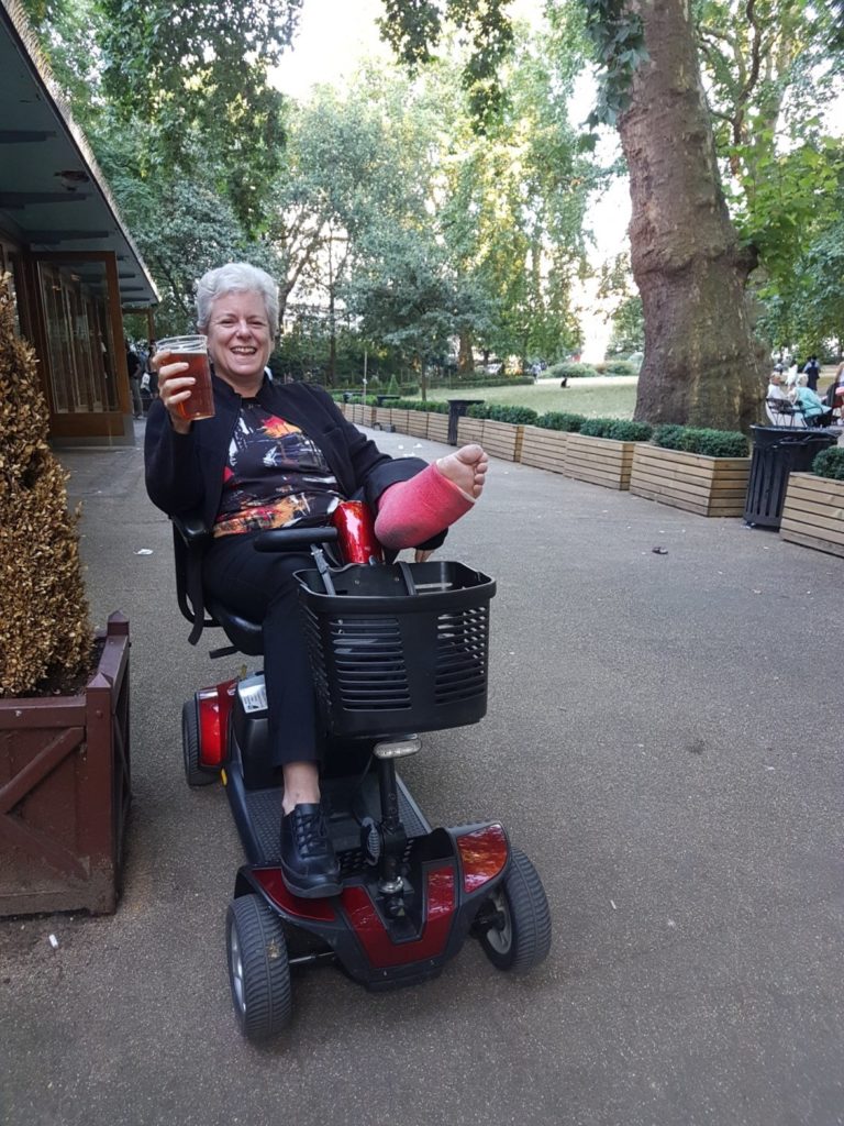 Enjoying watching FIFA in the park from my scooter